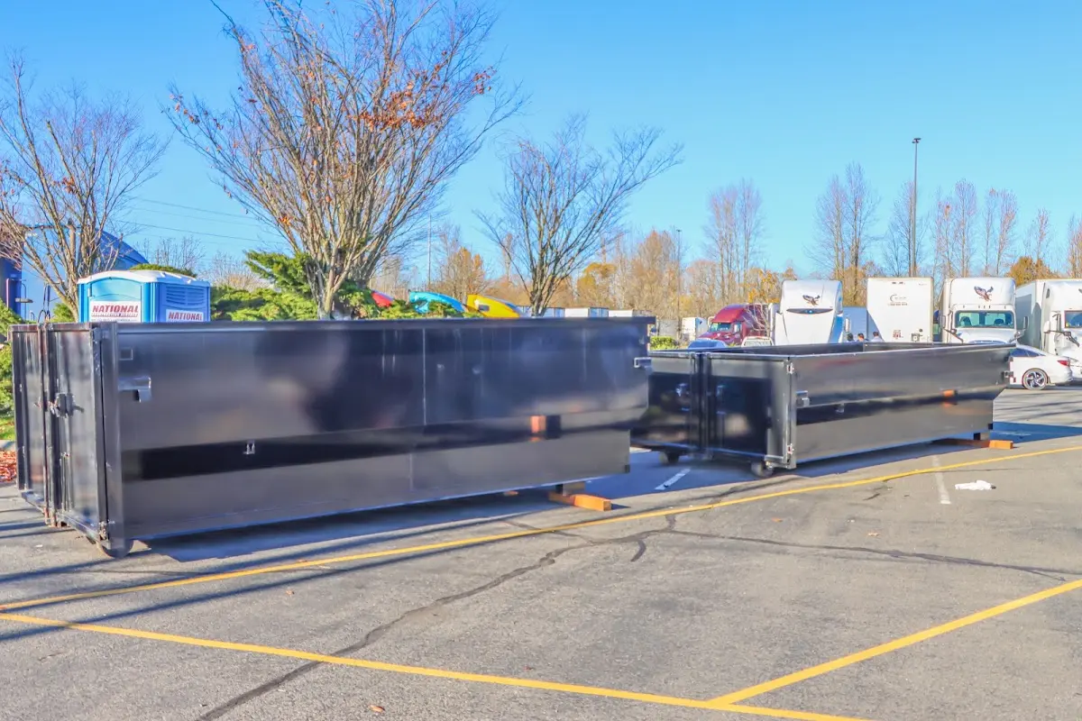 Professional dumpster rental service with roll-off container on residential driveway in Citrus